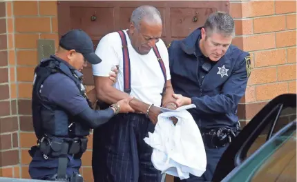  ?? JACQUELINE LARMA/AP ?? Bill Cosby is taken away in handcuffs after he was sentenced for felony sexual assault.
