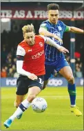  ??  ?? BATTLE: Luton’s Harry Cornick and Wigan’s Antonee Robinson