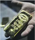  ?? OZAN KOSE / AFP / GETTY IMAGES ?? Physically backed gold ETFs are a useful
market to watch.