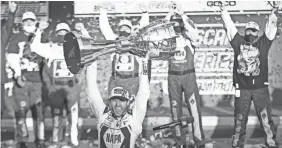  ?? PATRICK BREEN/THE ARIZONA REPUBLIC ?? Chase Elliott celebrates winning the NASCAR Cup Series championsh­ip with a win in the finale Sunday at Phoenix Raceway.