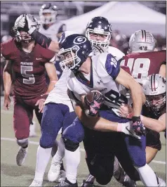  ?? (Special to NWA Democrat-Gazette/Brent Soule) ?? Greenwood’s Cameron Krone (center) fights for yardage against Siloam Springs’
Tyler Johnson (right).