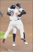  ?? Rich Schultz / Getty Images ?? Gleyber Torres celebrates with Aaron Judge, right, after his walk-off in the 11th.