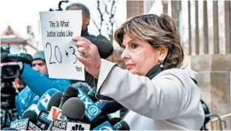  ?? GABRIELA BHASKAR/THE NEW YORK TIMES ?? Attorney and activist Gloria Allred holds a sign outside a New York courtroom referencin­g the 23-year sentence Harvey Weinstein received Wednesday for felony sex crimes.