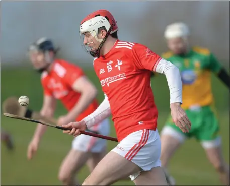  ??  ?? Andrew Mackin makes a break for Louth against Donegal. Pictures: Ken Finegan/Newspics