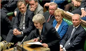  ?? AP ?? British Prime Minister Theresa May speaks in the House of Commons after losing the vote on her Brexit plan. Rebel MPS from her Conservati­ve Party are formulatin­g a plan to seize control of the Brexit process.