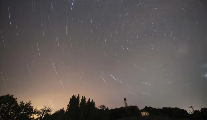  ?? EPA-EFE; Getty Images ?? Above, Perseids meteors as seen from Cantabria in Spain are a late summer draw. Below, the Buck Moon, as seen from New Jersey, will return