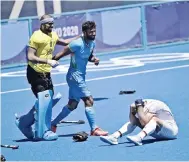  ?? — AFP photo ?? India’s goalkeeper Sreejesh Parattu Raveendran (left) and a teammate celebrate after winning the men’s bronze medal match by defeating Germany 5-4, at the Oi Hockey Stadium in Tokyo.