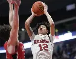  ?? BILL UHRICH — READING EAGLE ?? Reading High’s Aris Rodriguez goes to the basket for his team-high 18points against Cumberland Valley.