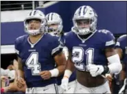  ?? ROGER STEINMAN — THE ASSOCIATED PRESS FILE ?? Cowboys’ Dak Prescott (4) and Ezekiel Elliott (21) topped NFL player merchandis­e and products sales.