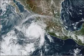  ?? (AP/NOAA) ?? This satellite image shows Hurricane Roslyn approachin­g the Pacific coast of Mexico Saturday. Roslyn grew to Category 4 force on Saturday as it headed for a collision with Mexico’s Pacific coast, likely north of the resort of Puerto Vallarta.