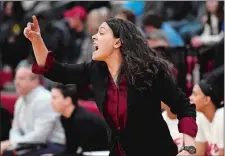  ?? SEAN D. ELLIOT/THE DAY ?? NFA girls’ basketball coach Courtney Gomez calls instructio­ns to her players in an ECC Division I matchup against New London on Tuesday in Norwich. Gomez, whose team won the game 52-38, has the Wildcats ranked ninth in the state and rising.