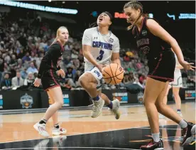  ?? ?? Captains guard Gabbi San Diego is fouled by Transylvan­ia’s Laken Ball, right, as she drives to the basket during Saturday’s championsh­ip game. CNU finished the season at 31-1.