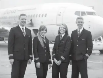  ?? DAVID BEBEE, RECORD STAFF ?? Sunwing Airlines first officers, from left, Cameron Fuchs, Chelsea Anne Edwards, Siobhan O’Hanlon and Spencer Leckie graduated from an aviation program offered by the University of Waterloo and the Waterloo Wellington Flight Centre.
