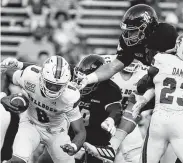  ?? Chronicle file photo ?? Rice defensive lineman Trey Schuman, right, hopes to put pressure on UTSA’s Lowell Narcisse this weekend.