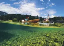  ??  ?? Lake Bled, main; paddling across Lake Bohinj, above