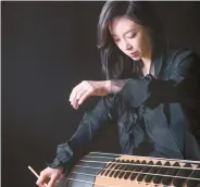  ??  ?? Geomungo (six-string zither) player Heo Yoon-jeong