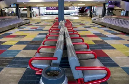  ?? Emily Matthews/Post-Gazette ?? The baggage claim area at Pittsburgh Internatio­nal Airport in Findlay was totally empty on Tuesday.