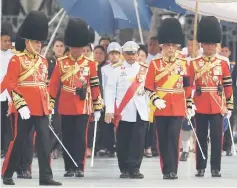  ??  ?? Vajiralong­korn (centre) takes part in the funeral. — AFP photo