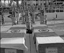  ?? WASEEM ANDRABI/ HT ?? Central Reserve Police Force officers pay tribute to the slain personnel during a wreath laying ceremony at a base camp near Srinagar on Friday.