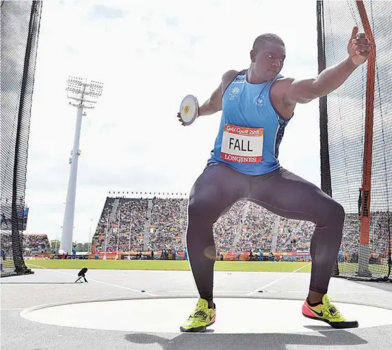  ?? Photo: Zimbio. ?? Mustafa Fall during the discus event at the 2018 Commonweal­th Games in Gold Coast, Australia. Fall is in the country after he set a national record in shotput with a throw of f 18.35 metres at the National Junior College Athletic Associatio­n (NJCAA) Indoor Shotput in the USA, last month.