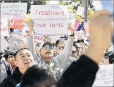  ??  ?? PROTESTS like this one in March outside a Board of Supervisor­s meeting helped doom temporary-shelter possibilit­ies on county land.