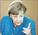  ?? PHOTO: REUTERS ?? German Chancellor Angela Merkel says they can relax labour rules to make it easier to hire and fire senior bankers.