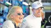  ??  ?? ■ Popstar Christina Aguilera with Lewis Hamilton after the Formula One driver won the Azerbaijan Grand Prix on Sunday. GETTY IMAGES