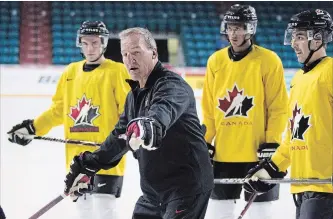  ?? CANADIAN PRESS FILE PHOTO ?? Canada coach Tim Hunter gives some instructio­ns during practice at the Sandman Centre in Kamloops, B.C., in July. The Canada-Russia Series consists of six games between Can ada’s juniors and the Russian junior national team. The first two games are out west Monday and Tuesday.