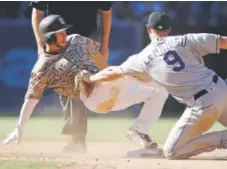  ?? Alex Gallardo, Associated Press file ?? Rockies second baseman DJ LeMahieu tags out San Diego’s Cory Spangenber­g last season.