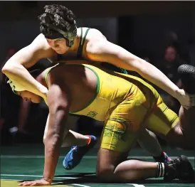  ?? O-N-E PHOTOS BY MICHELLE THOMPSON ?? ABOVE: Bandys wrestler Zackory Evans competing against Alleghany’s Hayden Williams in the 215-pound bout on Friday. BELOW: Trojans wrestler Ian Moore getting the advantage over Alleghany’s Dylan Phillips in the 190-pound match on Friday, Jan. 5.