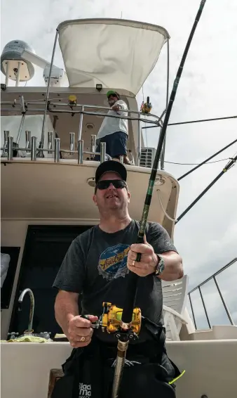  ??  ?? Jim Czaban puts the heat on a nice blue marlin under the watchful eyes of Capt. Tommy Lynskey, a longtime veteran of the Golfito seamount fishery (above).