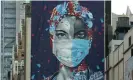  ?? Photograph: Timothy A Clary/AFP/Getty Images ?? A mural honoring healthcare workers at Montefiore medical center in the Bronx.