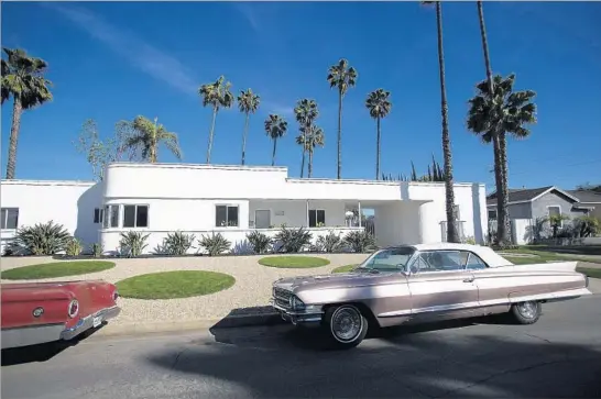  ?? Gina Ferazzi Los Angeles Times ?? THE OWNERS of this 1934 Streamline Moderne home in Long Beach designed a geometric, water-conserving lawn to complement the house’s Industrial Age curves.
