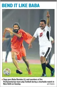  ?? AFP PHOTO ?? Yoga guru Baba Ramdev (L) and members of the Parliament­arian team play football during a charitable match in New Delhi on Sunday.