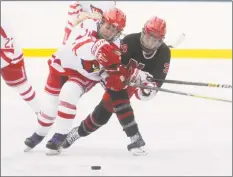  ?? Dave Stewart / Hearst Connecticu­t Media ?? Greenwich’s Jennifer Kelly (18) and New Canaan’s Angelica Megdanis collide near center ice during the Winter Classic at the Greenwich Skating Club on Saturday.