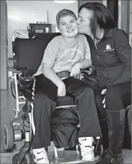  ?? [FRED SQUILLANTE/DISPATCH] ?? Kelly Maynard establishe­d the Little Hercules Foundation to help families cope with the effects of Duchenne muscular dystrophy. Her son Jackson, 10, was diagnosed with the disease when he was 5.