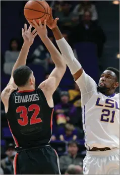  ?? Hilary Scheinuk / The Advocate via AP ?? LSU forward Aaron Epps (21) defends against Georgia forward Mike Edwards (32) during the first half of Tuesday’s game in Baton Rouge, La.