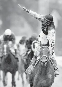  ?? DARRON CUMMINGS/AP ?? Calvin Borel reacts after riding Mine That Bird to win the 135th Kentucky Derby as a 50-to-1 longshot at Churchill Downs in Louisville, Ky., on May 2, 2009.