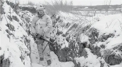  ?? ALEXEI ALEXANDROV/AP ?? A soldier stands in a trench in territory controlled by pro-Russian militants Tuesday in Slavyanose­rbsk, Ukraine.