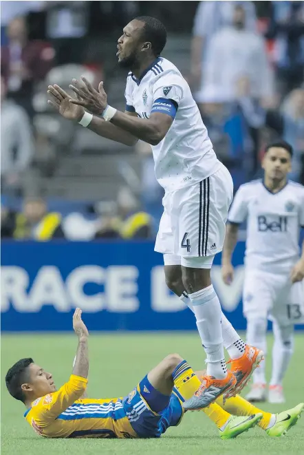  ??  ?? Whitecaps Kendall Waston, centre, reacts to a call after knocking down Tigres Javier Aquino during a CONCACAF Champions League semifinal in Vancouver on April 5.