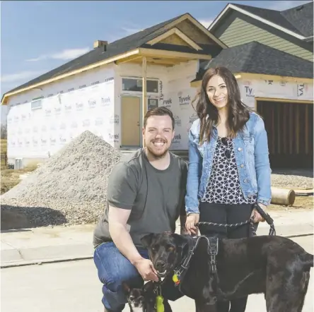  ?? Don Molyneaux ?? Jayman buyers Kevin Huartson and Kayla Sambrooke in front of their new home in Legacy.