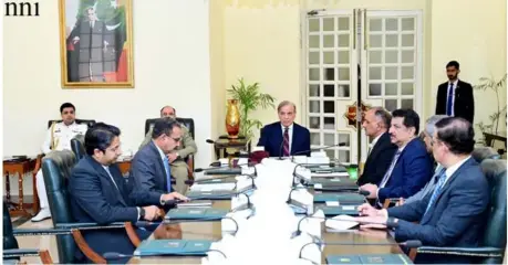  ?? ?? Islamabad: PM Shehbaz Sharif being briefed about the relief and rehabilita­tion activities in the wake of recent torrential rains as well as weather forecast and preparedne­ss.