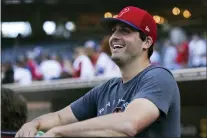  ?? DERRICK TUSKAN — THE ASSOCIATED PRESS ?? Phillies relief pitcher Mark Appel smiles in the dugout before the team’s game in San Diego Saturday night. The 2013No. 1overall draft pick received his first major league call-up Saturday at the age of 30.