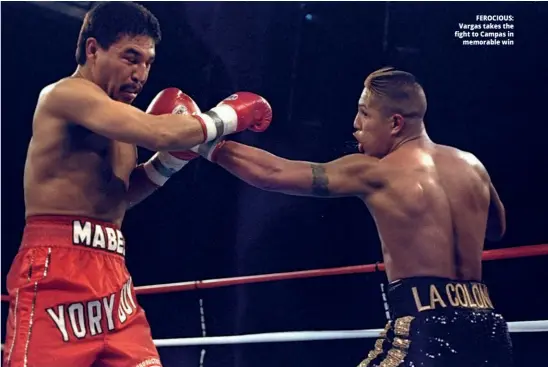  ??  ?? FEROCIOUS: Vargas takes the fight to Campas in memorable win