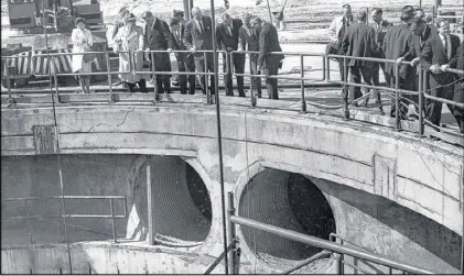  ??  ?? In the mid-1960s, the world’s largest rocket engine was tested in a deep pit in Camden County. An onlooker described it as “a most awesome manmade pit that could well set the stage for man’s first trip to moon.”