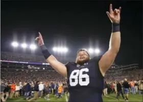  ?? BRYNN ANDERSON — THE ASSOCIATED PRESS ?? Auburn tight end Tucker Brown celebrates after the Iron Bowl NCAA college football game, Saturday in Auburn, Ala. Auburn won 26-14.