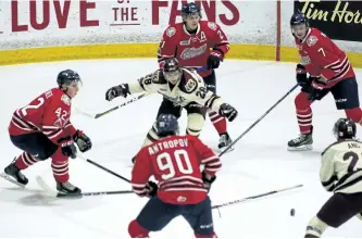  ?? JESSICA NYZNIK/EXAMINER ?? Peterborou­gh Petes Logan DeNoble, who returned to the lineup after being down with an injury, attempts to block a swarm of Oshawa Generals players from the puck after he loses his stick during the second period at the Memorial Centre on Thursday night....