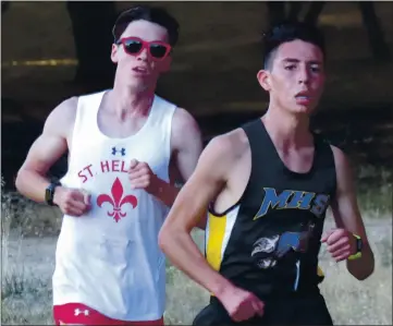  ?? PHOTO BY BRIAN SUMPTER ?? Cross country was given the green light to proceed under new state health guidelines issued late Monday for high school sports, which is good news for senior Isaac Rascon (above, right) and his Middletown High School teammates.