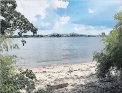  ?? ANDREA SACHS THE WASHINGTON POST ?? At Crescent Park, part of New Orleans’ riverfront developmen­t, trail-users can pass a sliver of beach on the Mississipp­i.