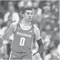  ?? RUSZKOWSKI / USA TODAY TREVOR ?? The improved play of D'Mitrik Trice was one of several reasons the Badgers were able to grab a share of the Big Ten title.